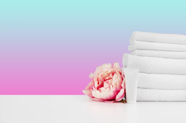 imgi_115_stacked-clean-towels-white-table-against-color-background_93675-122041